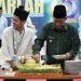 Pemotongan tumpeng Wagub Sani Dan Ketua PMII Jambi (Dok Foto:Komimfo Jambi)